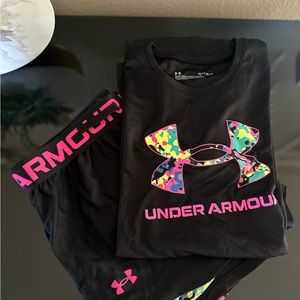 Under Armour pink and black shirt and shorts.